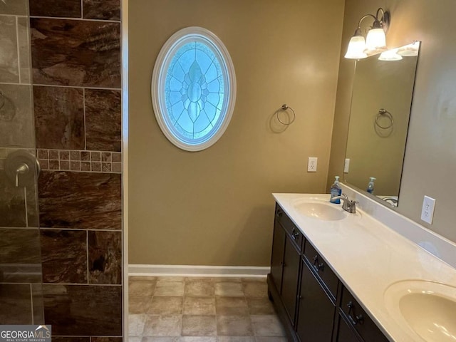1429 Thyatira Brockton Rd, Jefferson, GA 30549 - full bathroom with double vanity, baseboards, and tiled shower