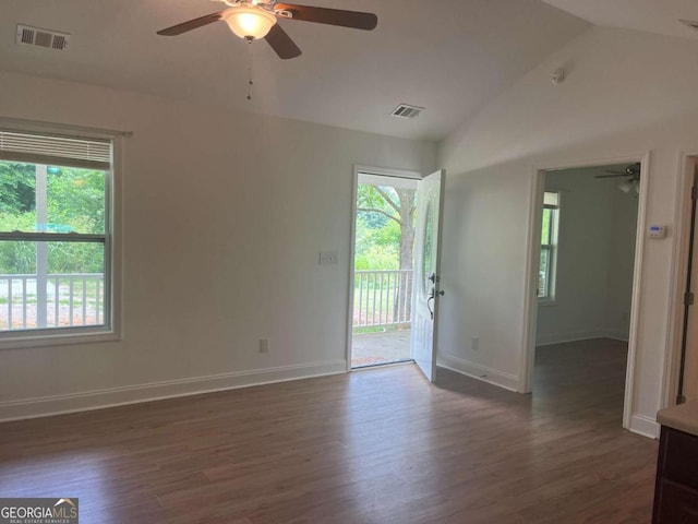 1429 Thyatira Brockton Rd, Jefferson, GA 30549 - unfurnished room featuring a ceiling fan, healthy amount of natural light, lofted ceiling, dark wood finished floors, and baseboards