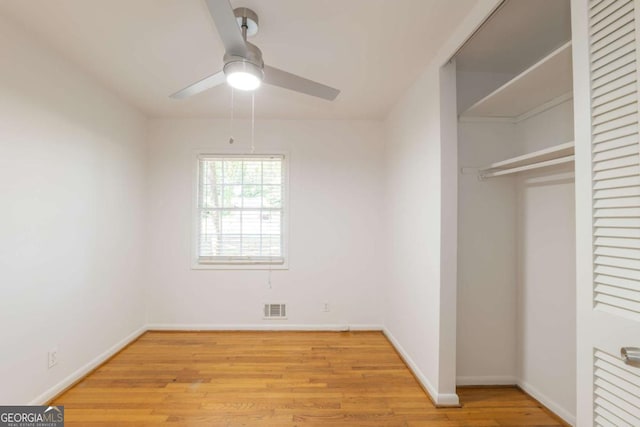 1671 Drayton Woods Dr, Tucker, GA 30084 - unfurnished bedroom featuring a closet, light wood-type flooring, and baseboards
