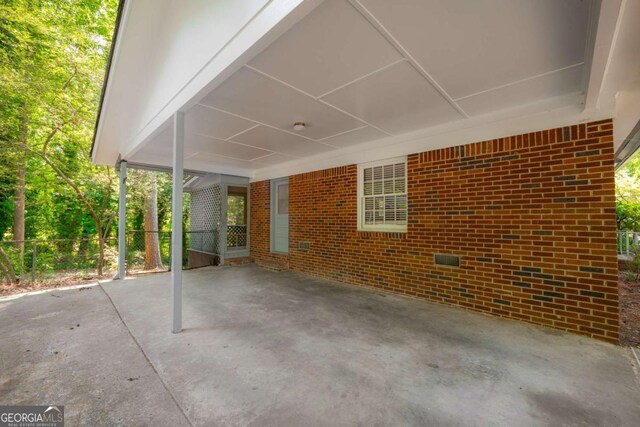 1671 Drayton Woods Dr, Tucker, GA 30084 - view of patio / terrace featuring an attached carport