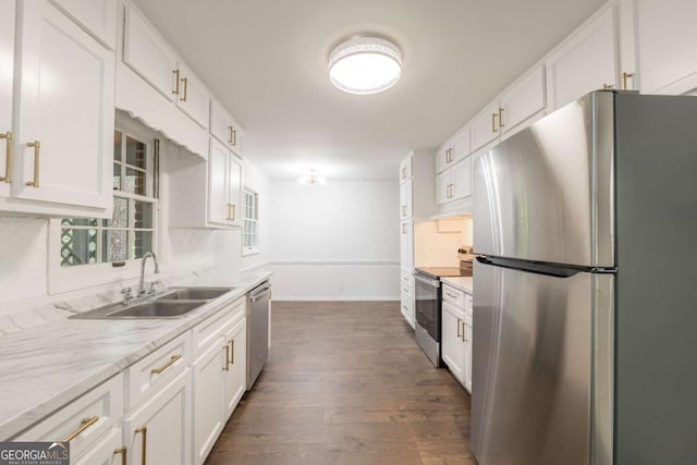 1671 Drayton Woods Dr, Tucker, GA 30084 - kitchen featuring appliances with stainless steel finishes, a sink, white cabinets, baseboards, and dark wood-style flooring