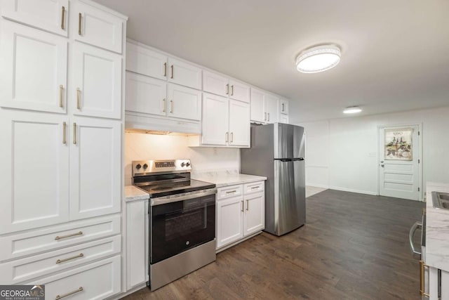 1671 Drayton Woods Dr, Tucker, GA 30084 - kitchen with stainless steel appliances, under cabinet range hood, white cabinetry, dark wood-type flooring, and backsplash