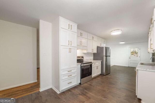 1671 Drayton Woods Dr, Tucker, GA 30084 - kitchen featuring appliances with stainless steel finishes, under cabinet range hood, light countertops, and white cabinets
