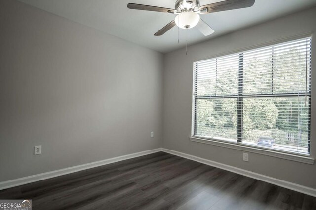 211 N Ave Unit 1122, Athens, GA 30601 - empty room with healthy amount of natural light, dark wood-style flooring, baseboards, and a ceiling fan