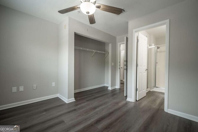 211 N Ave Unit 1122, Athens, GA 30601 - unfurnished bedroom featuring dark wood-style floors, a closet, baseboards, and ceiling fan