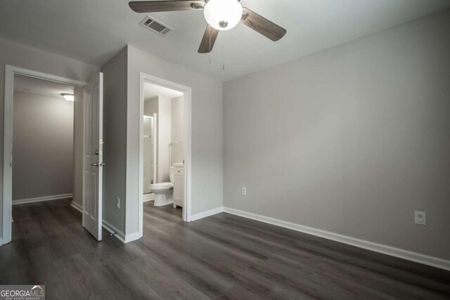 211 N Ave Unit 1122, Athens, GA 30601 - unfurnished bedroom with dark wood-type flooring, baseboards, connected bathroom, and ceiling fan