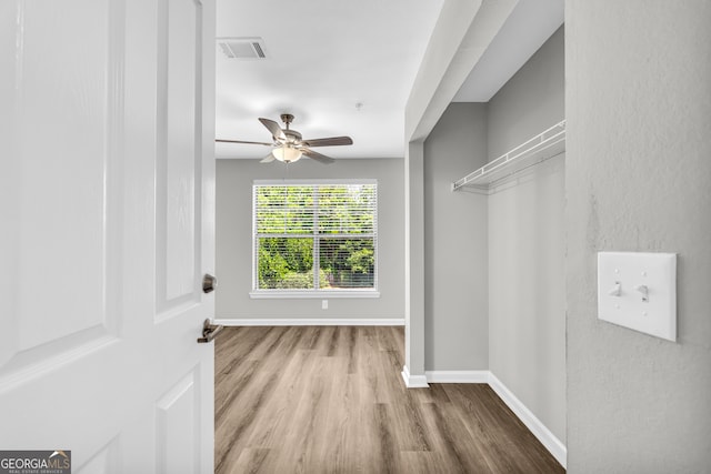 211 N Ave Unit 1122, Athens, GA 30601 - unfurnished bedroom featuring wood finished floors and a ceiling fan