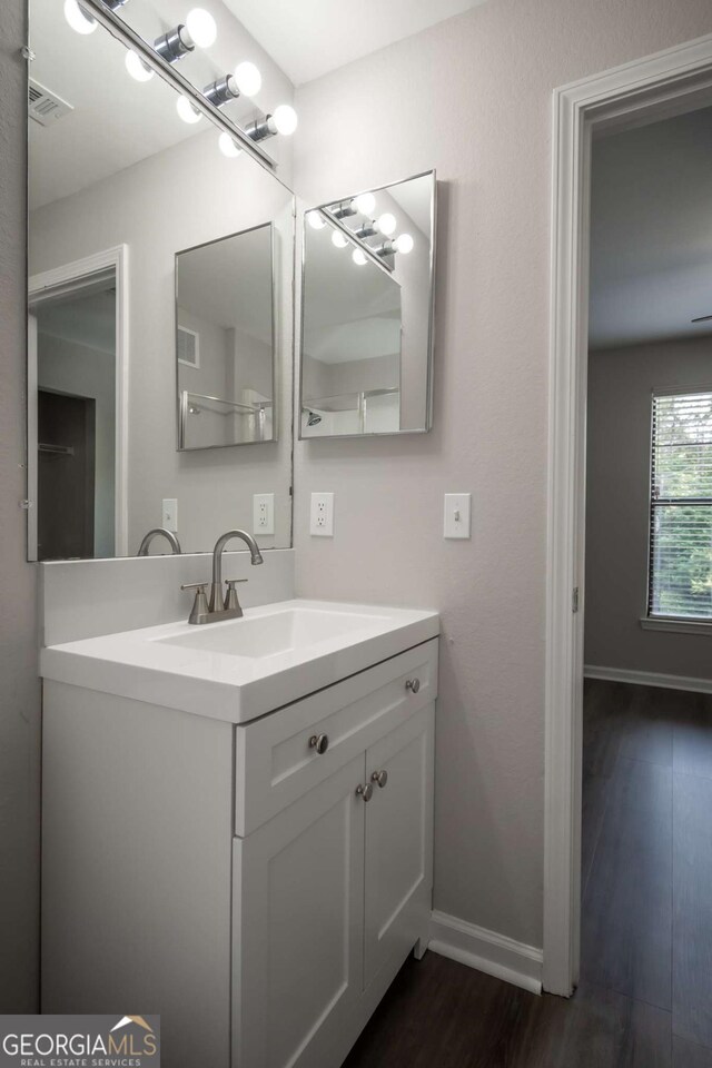 211 N Ave Unit 1122, Athens, GA 30601 - bathroom featuring vanity, wood finished floors, and baseboards