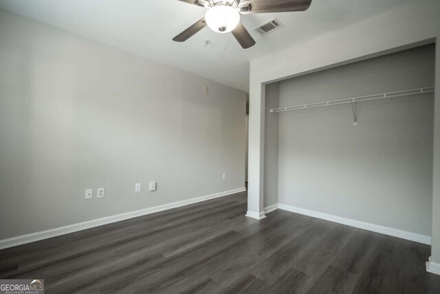 211 N Ave Unit 1122, Athens, GA 30601 - unfurnished bedroom with dark wood-style floors, a closet, baseboards, and a ceiling fan
