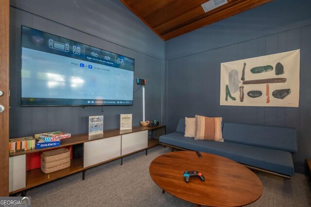 211 N Ave Unit 1122, Athens, GA 30601 - living area with carpet flooring, wood ceiling, lofted ceiling, and wood walls