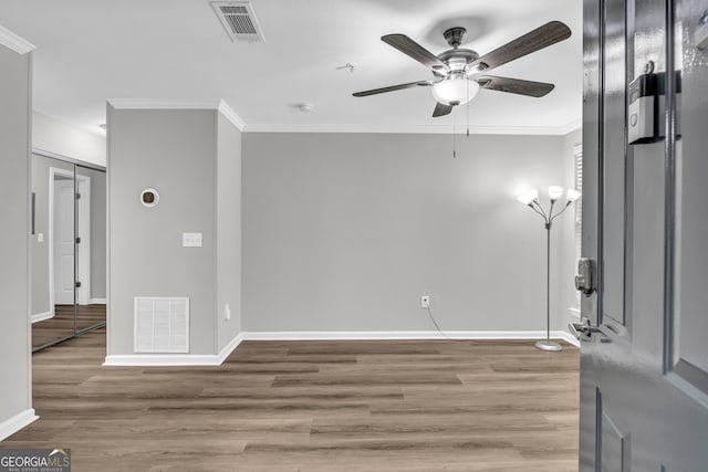 211 N Ave Unit 1122, Athens, GA 30601 - unfurnished room featuring crown molding, a ceiling fan, and wood finished floors