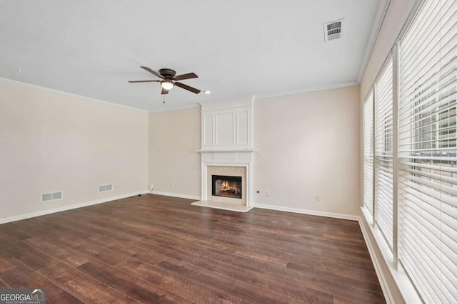 153 Towey Trl, Woodstock, GA 30188 - unfurnished living room with a ceiling fan, dark wood-style floors, a large fireplace, crown molding, and baseboards
