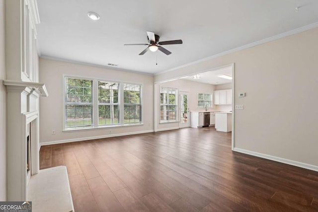 153 Towey Trl, Woodstock, GA 30188 - unfurnished living room with a ceiling fan, baseboards, dark wood-type flooring, crown molding, and a fireplace