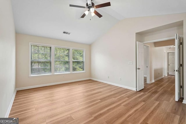 153 Towey Trl, Woodstock, GA 30188 - spare room featuring ceiling fan, light wood-style flooring, vaulted ceiling, and baseboards