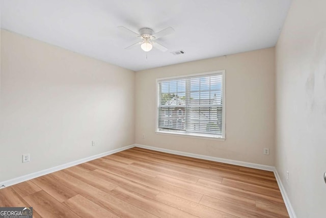153 Towey Trl, Woodstock, GA 30188 - spare room with a ceiling fan, light wood-style floors, and baseboards