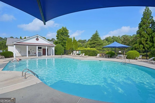 153 Towey Trl, Woodstock, GA 30188 - community pool featuring a patio
