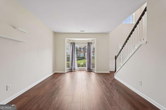 153 Towey Trl, Woodstock, GA 30188 - foyer with stairs, plenty of natural light, and dark wood-type flooring