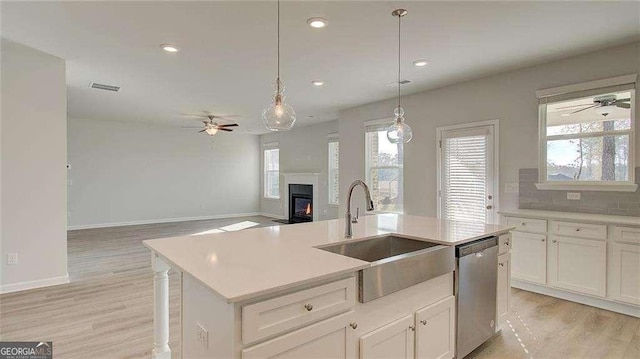 308 Delta Dr, Mcdonough, GA 30253 - kitchen with dishwasher, a sink, ceiling fan, light wood finished floors, and recessed lighting