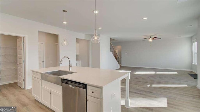 308 Delta Dr, Mcdonough, GA 30253 - kitchen featuring stainless steel dishwasher, a sink, a ceiling fan, baseboards, and recessed lighting