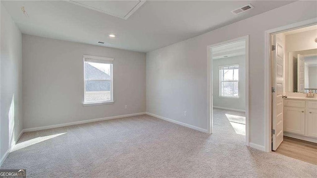 308 Delta Dr, Mcdonough, GA 30253 - empty room featuring light carpet, healthy amount of natural light, and baseboards