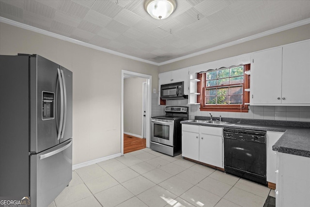 206 Brown St, Carrollton, GA 30117 - kitchen featuring black appliances, dark countertops, a sink, white cabinetry, and ornamental molding