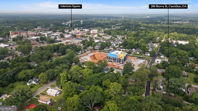 206 Brown St, Carrollton, GA 30117 - aerial view of property and surrounding area featuring a heavily wooded area