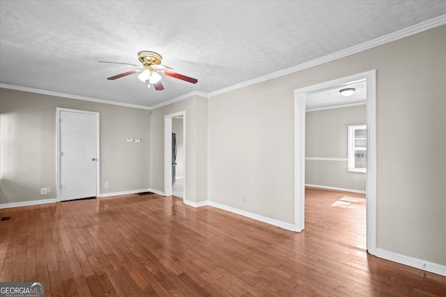 206 Brown St, Carrollton, GA 30117 - empty room with a ceiling fan, wood-type flooring, baseboards, and ornamental molding