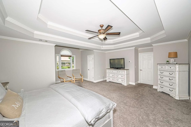 1409 Echo Mill Dr, Powder Springs, GA 30127 - carpeted bedroom with a tray ceiling, crown molding, ceiling fan, and baseboards