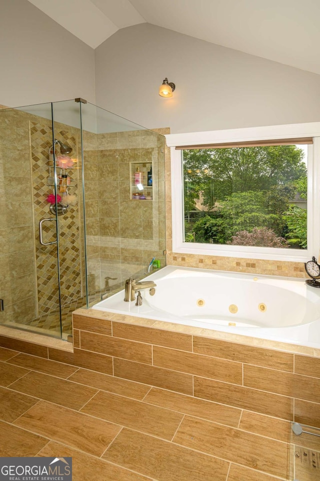 1409 Echo Mill Dr, Powder Springs, GA 30127 - full bath with lofted ceiling, a tub with jets, and a shower stall