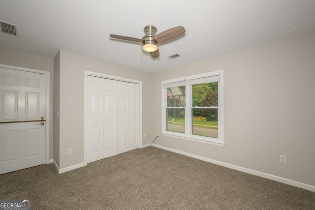 1409 Echo Mill Dr, Powder Springs, GA 30127 - unfurnished bedroom with carpet flooring, baseboards, a closet, and ceiling fan