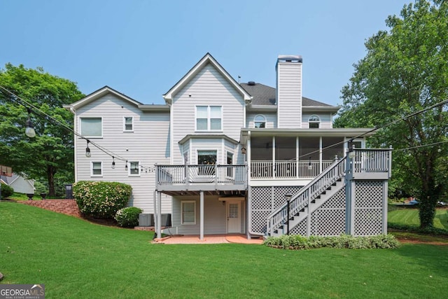 1409 Echo Mill Dr, Powder Springs, GA 30127 - back of house featuring a sunroom, a chimney, a lawn, and stairway
