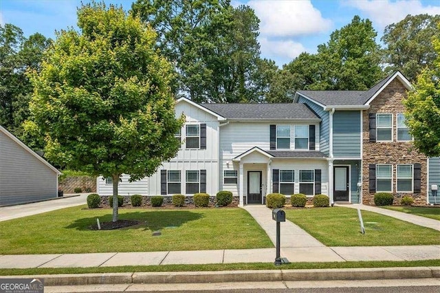 5880 Garden Cir, Douglasville, GA 30135 - townhome / multi-family property featuring stone siding, board and batten siding, and a front lawn