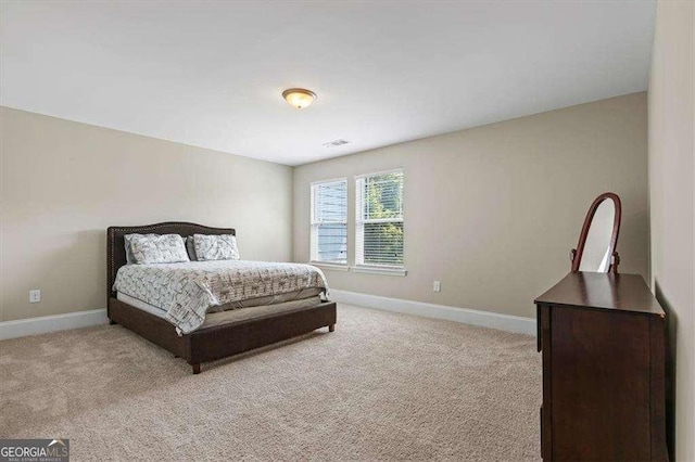 5880 Garden Cir, Douglasville, GA 30135 - bedroom featuring light colored carpet and baseboards