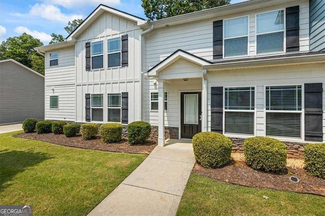 5880 Garden Cir, Douglasville, GA 30135 - view of front of home featuring board and batten siding and a front yard