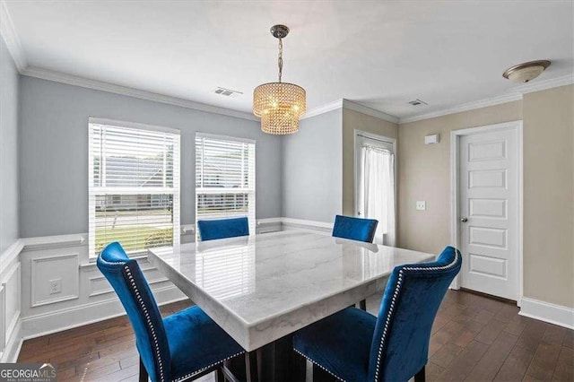 5880 Garden Cir, Douglasville, GA 30135 - dining room featuring dark wood finished floors, a chandelier, ornamental molding, and baseboards