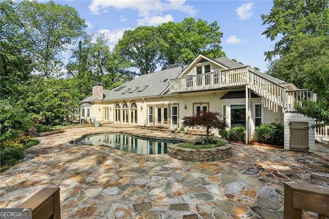 511 Pine Valley Rd SE, Marietta, GA 30067 - rear view of house with french doors, a patio, a chimney, an outdoor pool, and stairway