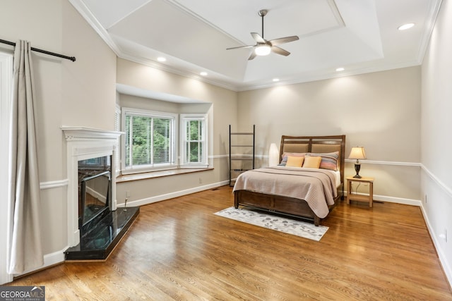 511 Pine Valley Rd SE, Marietta, GA 30067 - bedroom with a tray ceiling, wood finished floors, a premium fireplace, crown molding, and recessed lighting