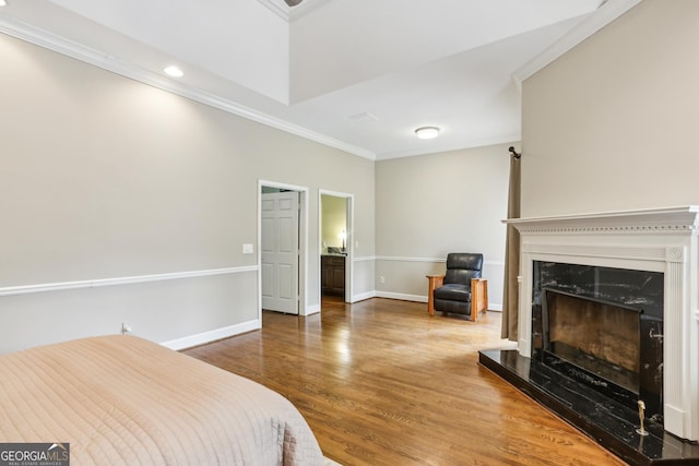 511 Pine Valley Rd SE, Marietta, GA 30067 - bedroom with ornamental molding, wood finished floors, a fireplace, and recessed lighting