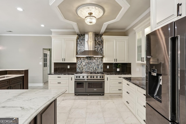 511 Pine Valley Rd SE, Marietta, GA 30067 - kitchen featuring fridge with ice dispenser, range with two ovens, wall chimney exhaust hood, light marble finish floors, and dark stone counters