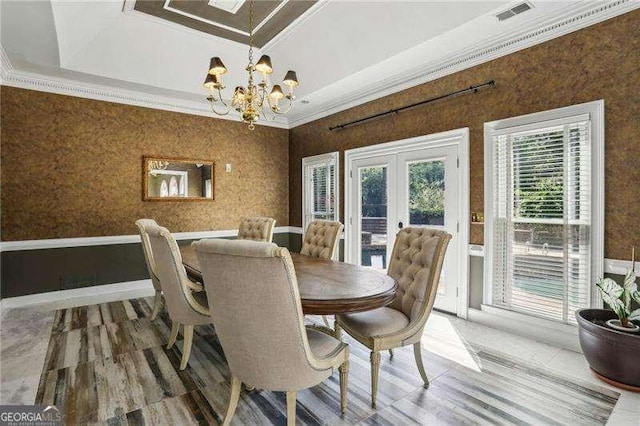 511 Pine Valley Rd SE, Marietta, GA 30067 - dining space featuring french doors, a chandelier, ornamental molding, and wood finished floors
