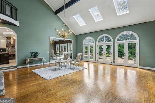 511 Pine Valley Rd SE, Marietta, GA 30067 - dining space featuring high vaulted ceiling, french doors, beam ceiling, plenty of natural light, and wood finished floors