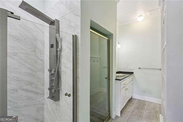 511 Pine Valley Rd SE, Marietta, GA 30067 - bathroom featuring a stall shower, vanity, and ornamental molding