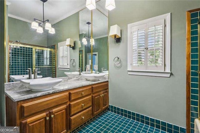 511 Pine Valley Rd SE, Marietta, GA 30067 - bathroom featuring double vanity, ornamental molding, plenty of natural light, a stall shower, and a chandelier
