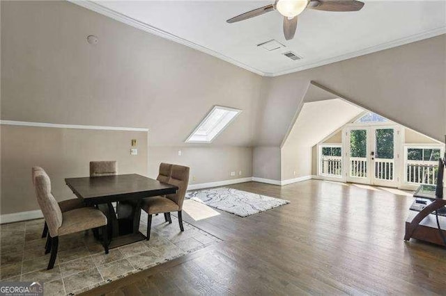 511 Pine Valley Rd SE, Marietta, GA 30067 - dining room featuring wood finished floors, ceiling fan, a skylight, crown molding, and vaulted ceiling
