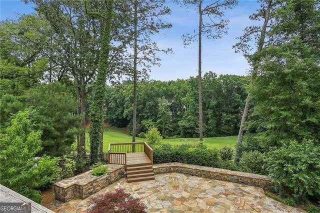 511 Pine Valley Rd SE, Marietta, GA 30067 - surrounding community with a view of trees and a patio area