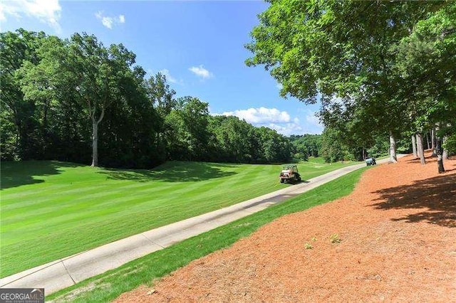 511 Pine Valley Rd SE, Marietta, GA 30067 - view of community with golf course view and a lawn
