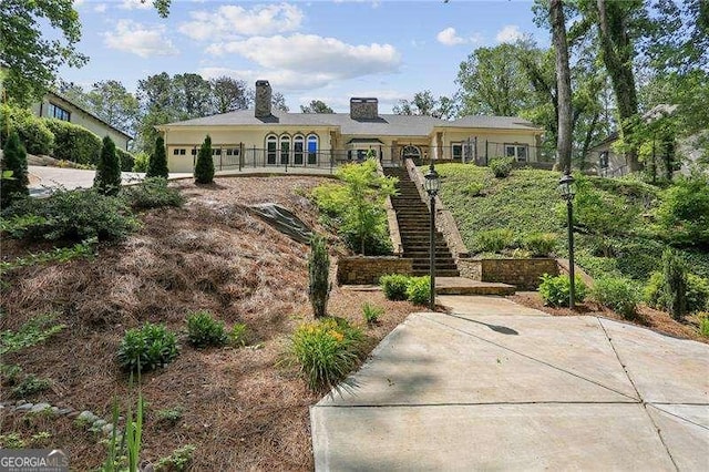 511 Pine Valley Rd SE, Marietta, GA 30067 - view of front of home with stairway, a garage, and a chimney
