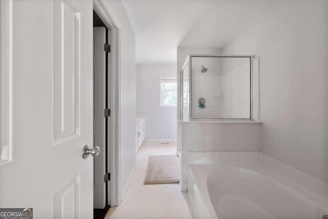 2820 Channing Way, Cumming, GA 30040 - full bathroom with a stall shower, a garden tub, baseboards, and vanity
