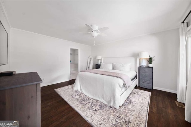 2820 Channing Way, Cumming, GA 30040 - bedroom with baseboards, dark wood-style floors, crown molding, and a ceiling fan