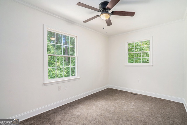 2674 Skylane Dr, Marietta, GA 30062 - empty room featuring crown molding, dark colored carpet, and a ceiling fan